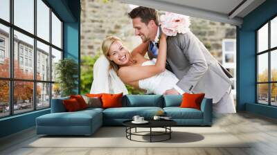 Romantic Bride And Groom Embracing Outdoors Wall mural