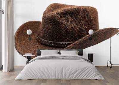 A brown cowboy hat set against a black background, emphasizing its classic design and rich color. Wall mural