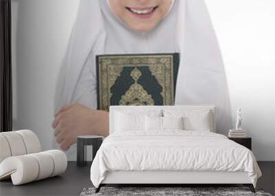 Smiling Muslim Girl Loves Holy Book of Quran Wall mural