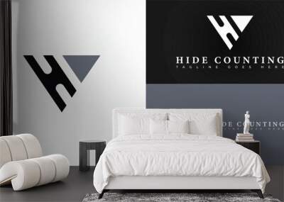 abstract negative space initial letter HC or CH logo in black color and triangle shape isolated on multiple background colors. The logo is suitable for accounting and financial logo design inspiration Wall mural