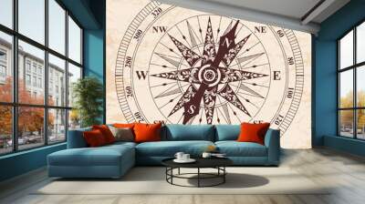 Compass with an arrow. old vector. Rose of Wind. Brown pattern on the beige background with the aging effect. Wall mural