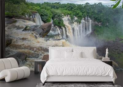 View of the Kalandula waterfalls on Lucala river, tropical forest and cloudy sky as background Wall mural