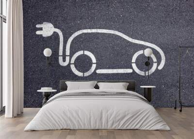 Top view of an electric vehicle symbol on the street Wall mural