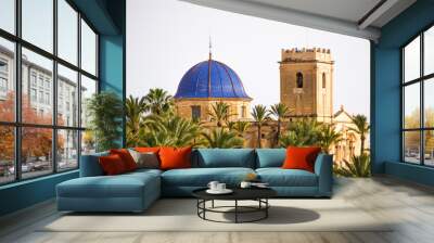 Arabic mosque with beautiful blue roof surrounded by a set of palm trees in Elche, Spain. Wall mural