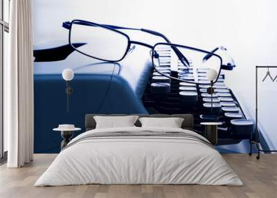 glasses on vintage typewriter Wall mural