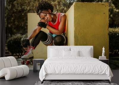 Beautiful black woman posing on roller skates Wall mural