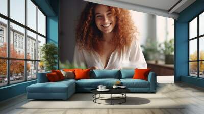 One young stylish woman with red hair having a healthy breakfast at home. Wall mural