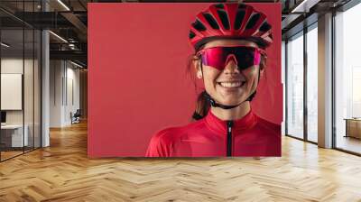 photo portait of cycling woman smiling with sport sunglasses on with one color background Wall mural