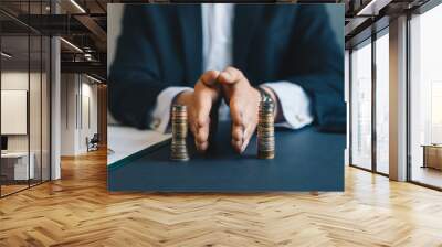 Concept of  saving and investing. Businessman separates stack coins. Property division. Divorce and legal services. Wall mural