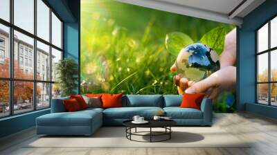 Environment day and Earth Day concept. Save clean planet, ecology development. Renewable energy-based green businesses can limit climate change and global warming.	
 Wall mural