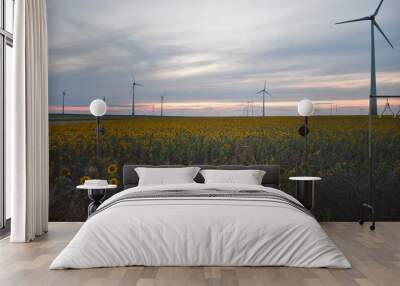 windmill at sunset in sunflower field Wall mural