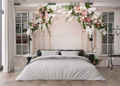 Arch for the wedding ceremony, decorated with white and pink flowers. Wall mural