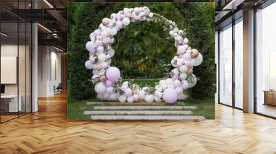 Ouside wedding ceremony. Balloon wedding arch in the garden. Wall mural