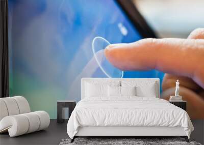 finger touching tablet device Wall mural