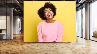 Colorful studio portrait of an african-american young woman smiling happily, yellow and pink. Generative AI Wall mural