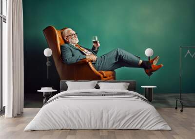 Funny old man, chilling and relaxing in an armchair, drinking a cocktail. Generative AI Wall mural