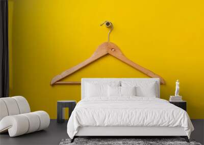 a simple empty clothes hanger on the wall hook, fashion cloth textile storage Wall mural