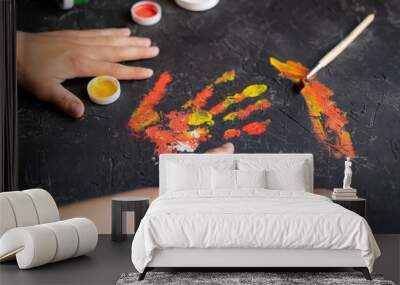 eco paint drawing fo kids, hand palm draw imprint finger on adrk surface Wall mural