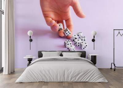 hands holding dice game cubes and roll on table. gamble chances Wall mural