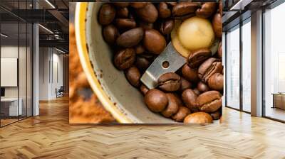 op view of the electric coffee bean grinder on the table, coffee powders Wall mural