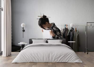 Woman in Casual Home Attire Selecting Clothes From a Wardrobe Wall mural