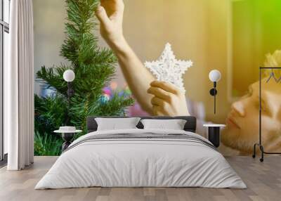 young bearded man at home doing domestic preparation to the christmas new year holidays concept f Wall mural