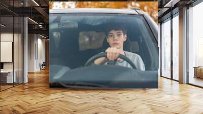 young teenager learns how to drive the car  f Wall mural