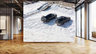 Two cars on the parking. Winter day. Top view. Wall mural