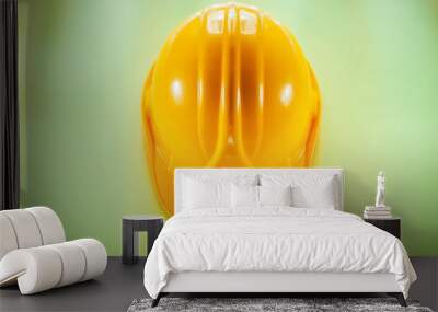 Protective hard hat on yellow background Wall mural