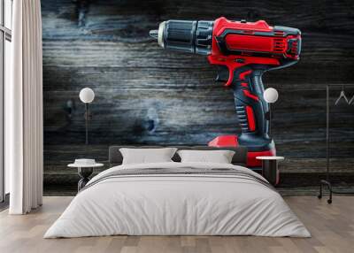 red cordless drill driver electric screwdriver on vintage wood background Wall mural