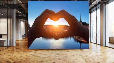 heart shape hand in stockholm city Wall mural