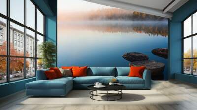 Still lake with boulders at sunrise Wall mural