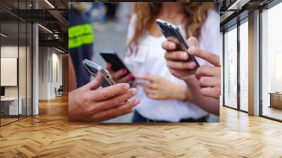 Checking the green pass on a smartphone, required for entry to an exhibition event. Selective focus.  Aosta, Italy - August 2021 Wall mural