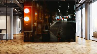 Traffic light against the blurred background of a road at night Wall mural