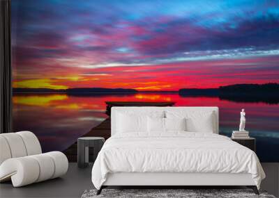 Beautiful colourful sunset with a wooden jetty in the Lake Wall mural