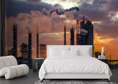 chemical plant at sunrise. Smoke and pollution illuminated by the rays of the rising sun Wall mural