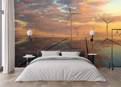 clean energy concept, photovoltaic panels and wind turbines in the light of the rising sun Wall mural