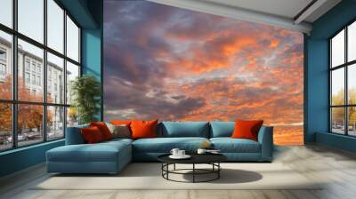 Fiery sunset, colorful clouds in the sky Wall mural