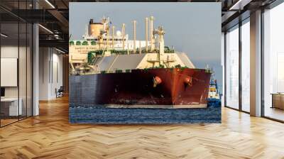 Lng tanker assisted by tug boats entering the port	 Wall mural