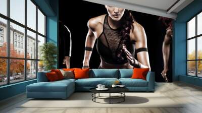 A strong athletic, women sprinter, running on black background wearing in the sportswear, fitness and sport motivation. Runner concept. Wall mural