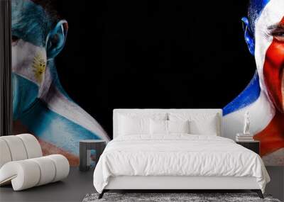 Soccer or football fan with bodyart on face with agression - flag of France vs Argentina. Wall mural