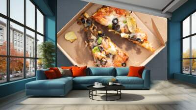 leftover vegi vegetable pizza in soiled cardboard box Wall mural