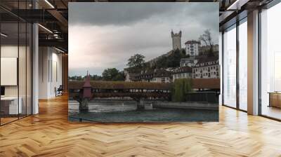 Lucerne, Switzerland: view of the Lucerne bridge and the river, and the castle in the background Wall mural