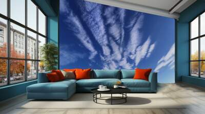 Blue sky with spindrift clouds Wall mural