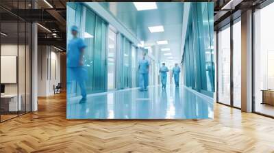 Medical staff walking in a modern hospital corridor with glass walls and bright lighting Wall mural