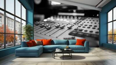 Sound recording studio mixing desk. Music mixer control panel. Closeup. Selective focus. Black and White image Wall mural