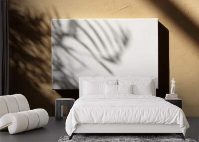 White blank canvas hanging on wall with shadows. Mockup Wall mural