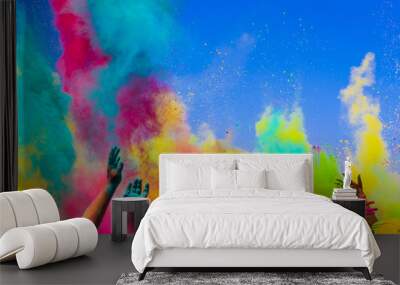 crowd throws colored powder at holi festival Wall mural