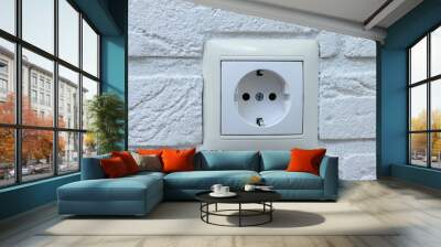 New electrical socket on brick wall. Wall mural