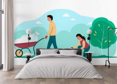 People clean up garbage in the park in nature. A man drives a wheelbarrow, a woman collects waste in a bag. Caring for cleanliness and ecology. Vector flat illustration Wall mural